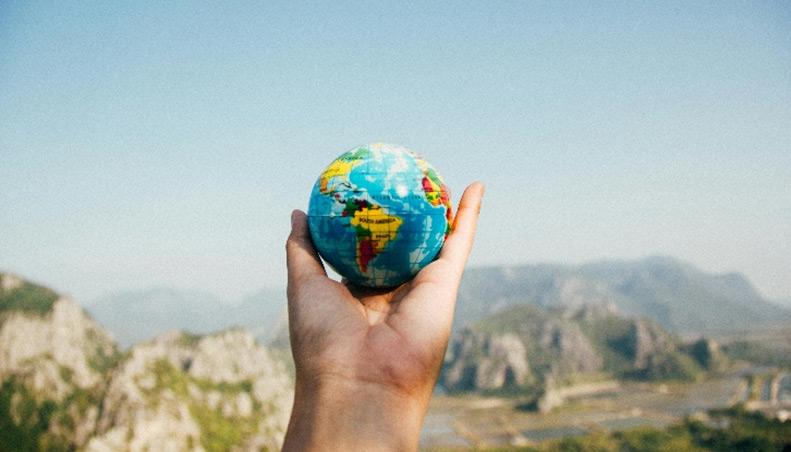 Globe in hand